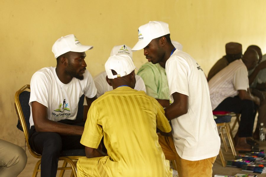 FirstPage Foundation volunteers in conversation with a community member